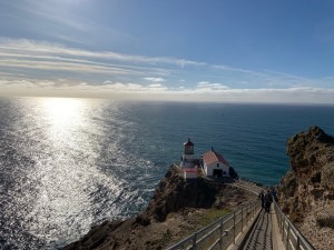 Inspirational lighthouse vista representing visionary nonprofit succession planning and the guiding leadership boards provide through organizational transitions